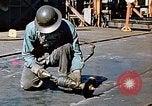 Image of Liberty ship deck plates are prepared for union melt at shipyard California United States USA, 1942, second 33 stock footage video 65675025805