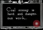 Image of process to get coal chunks in mine United States USA, 1922, second 1 stock footage video 65675025808