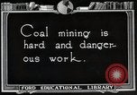 Image of process to get coal chunks in mine United States USA, 1922, second 3 stock footage video 65675025808
