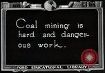 Image of process to get coal chunks in mine United States USA, 1922, second 4 stock footage video 65675025808
