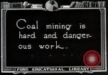 Image of process to get coal chunks in mine United States USA, 1922, second 5 stock footage video 65675025808