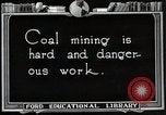 Image of process to get coal chunks in mine United States USA, 1922, second 6 stock footage video 65675025808
