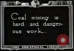 Image of process to get coal chunks in mine United States USA, 1922, second 7 stock footage video 65675025808