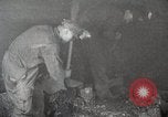 Image of process to get coal chunks in mine United States USA, 1922, second 8 stock footage video 65675025808