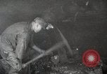Image of process to get coal chunks in mine United States USA, 1922, second 10 stock footage video 65675025808
