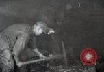 Image of process to get coal chunks in mine United States USA, 1922, second 12 stock footage video 65675025808