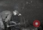 Image of process to get coal chunks in mine United States USA, 1922, second 13 stock footage video 65675025808