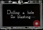 Image of process to get coal chunks in mine United States USA, 1922, second 17 stock footage video 65675025808