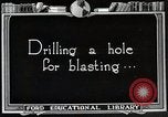 Image of process to get coal chunks in mine United States USA, 1922, second 20 stock footage video 65675025808