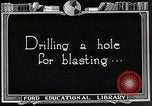 Image of process to get coal chunks in mine United States USA, 1922, second 21 stock footage video 65675025808