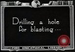 Image of process to get coal chunks in mine United States USA, 1922, second 22 stock footage video 65675025808