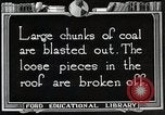 Image of process to get coal chunks in mine United States USA, 1922, second 58 stock footage video 65675025808