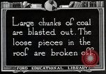 Image of process to get coal chunks in mine United States USA, 1922, second 59 stock footage video 65675025808