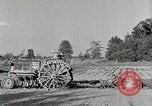 Image of Oliver tractor plows field Michigan United States USA, 1941, second 22 stock footage video 65675025822