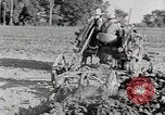 Image of Oliver tractor plows field Michigan United States USA, 1941, second 33 stock footage video 65675025822