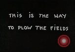 Image of Oliver tractor plows field Michigan United States USA, 1941, second 35 stock footage video 65675025822
