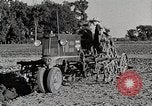 Image of Oliver tractor plows field Michigan United States USA, 1941, second 39 stock footage video 65675025822