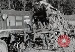 Image of Oliver tractor plows field Michigan United States USA, 1941, second 46 stock footage video 65675025822
