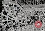Image of Oliver tractor plows field Michigan United States USA, 1941, second 50 stock footage video 65675025822