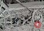 Image of Oliver tractor plows field Michigan United States USA, 1941, second 52 stock footage video 65675025822