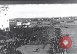 Image of Sightseers look at zeppelin wreckage displayed on dock  Salonica Greece, 1916, second 1 stock footage video 65675025842