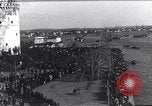 Image of Sightseers look at zeppelin wreckage displayed on dock  Salonica Greece, 1916, second 4 stock footage video 65675025842