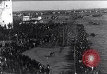 Image of Sightseers look at zeppelin wreckage displayed on dock  Salonica Greece, 1916, second 9 stock footage video 65675025842