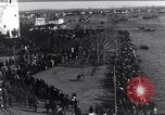 Image of Sightseers look at zeppelin wreckage displayed on dock  Salonica Greece, 1916, second 11 stock footage video 65675025842