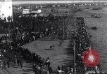 Image of Sightseers look at zeppelin wreckage displayed on dock  Salonica Greece, 1916, second 12 stock footage video 65675025842