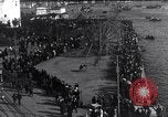 Image of Sightseers look at zeppelin wreckage displayed on dock  Salonica Greece, 1916, second 14 stock footage video 65675025842