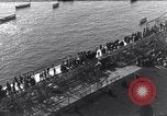 Image of Sightseers look at zeppelin wreckage displayed on dock  Salonica Greece, 1916, second 21 stock footage video 65675025842