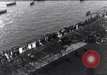 Image of Sightseers look at zeppelin wreckage displayed on dock  Salonica Greece, 1916, second 22 stock footage video 65675025842