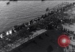 Image of Sightseers look at zeppelin wreckage displayed on dock  Salonica Greece, 1916, second 26 stock footage video 65675025842