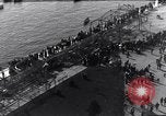 Image of Sightseers look at zeppelin wreckage displayed on dock  Salonica Greece, 1916, second 28 stock footage video 65675025842