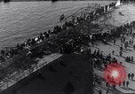 Image of Sightseers look at zeppelin wreckage displayed on dock  Salonica Greece, 1916, second 29 stock footage video 65675025842
