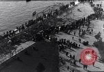 Image of Sightseers look at zeppelin wreckage displayed on dock  Salonica Greece, 1916, second 31 stock footage video 65675025842