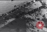 Image of Sightseers look at zeppelin wreckage displayed on dock  Salonica Greece, 1916, second 32 stock footage video 65675025842