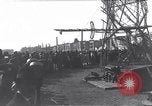 Image of Sightseers look at zeppelin wreckage displayed on dock  Salonica Greece, 1916, second 33 stock footage video 65675025842