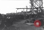 Image of Sightseers look at zeppelin wreckage displayed on dock  Salonica Greece, 1916, second 35 stock footage video 65675025842