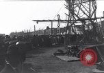 Image of Sightseers look at zeppelin wreckage displayed on dock  Salonica Greece, 1916, second 36 stock footage video 65675025842