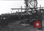 Image of Sightseers look at zeppelin wreckage displayed on dock  Salonica Greece, 1916, second 38 stock footage video 65675025842