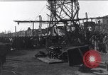 Image of Sightseers look at zeppelin wreckage displayed on dock  Salonica Greece, 1916, second 41 stock footage video 65675025842
