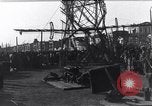 Image of Sightseers look at zeppelin wreckage displayed on dock  Salonica Greece, 1916, second 42 stock footage video 65675025842