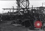 Image of Sightseers look at zeppelin wreckage displayed on dock  Salonica Greece, 1916, second 43 stock footage video 65675025842
