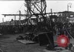 Image of Sightseers look at zeppelin wreckage displayed on dock  Salonica Greece, 1916, second 44 stock footage video 65675025842