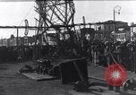 Image of Sightseers look at zeppelin wreckage displayed on dock  Salonica Greece, 1916, second 46 stock footage video 65675025842