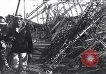 Image of Sightseers look at zeppelin wreckage displayed on dock  Salonica Greece, 1916, second 48 stock footage video 65675025842