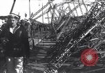 Image of Sightseers look at zeppelin wreckage displayed on dock  Salonica Greece, 1916, second 49 stock footage video 65675025842