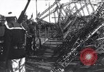 Image of Sightseers look at zeppelin wreckage displayed on dock  Salonica Greece, 1916, second 50 stock footage video 65675025842