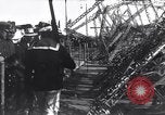 Image of Sightseers look at zeppelin wreckage displayed on dock  Salonica Greece, 1916, second 51 stock footage video 65675025842